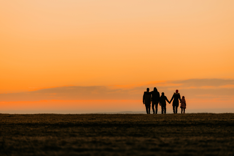 Family walking at distance during dusk Test Therapist