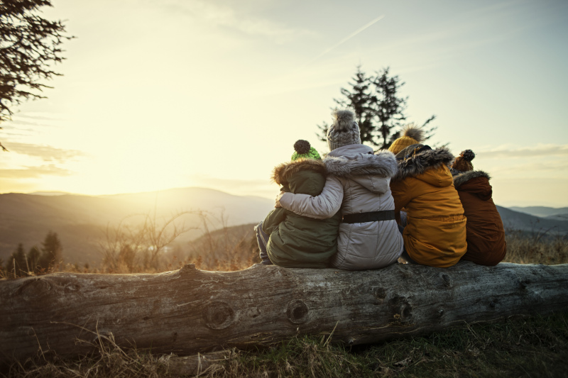 Family walking at distance during dusk Psychotherapy for Families in Collingwood, Ontario